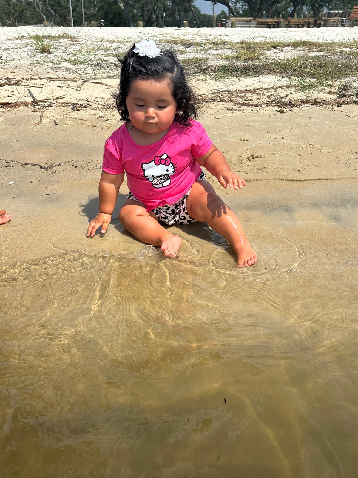 Toddler playing on the beach
